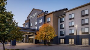 A Fairfield by Marriott hotel with a modern design, featuring a large entrance and multiple windows.