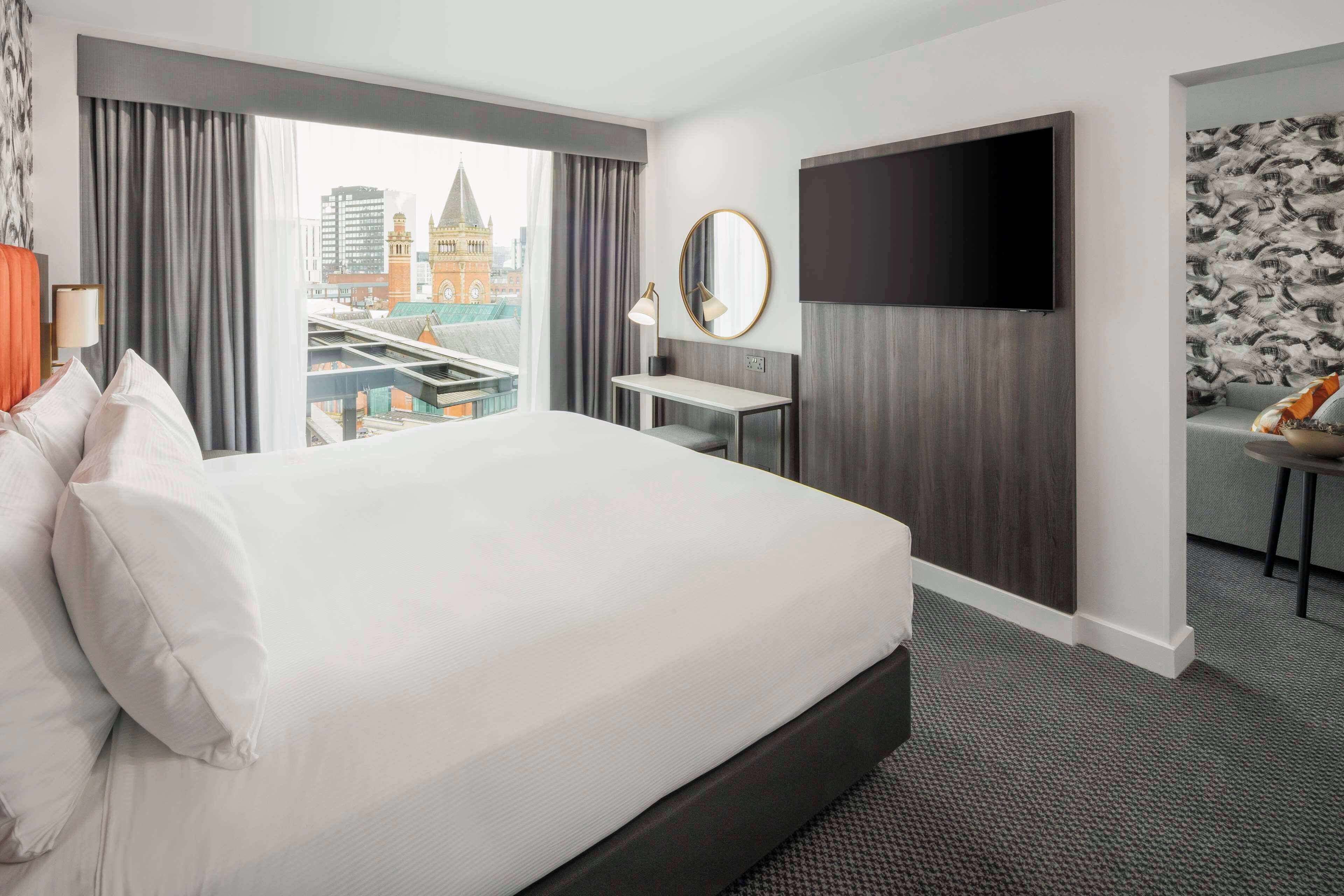 Suite, 1 King Bed, City View | Premium bedding, minibar, in-room safe, individually decorated