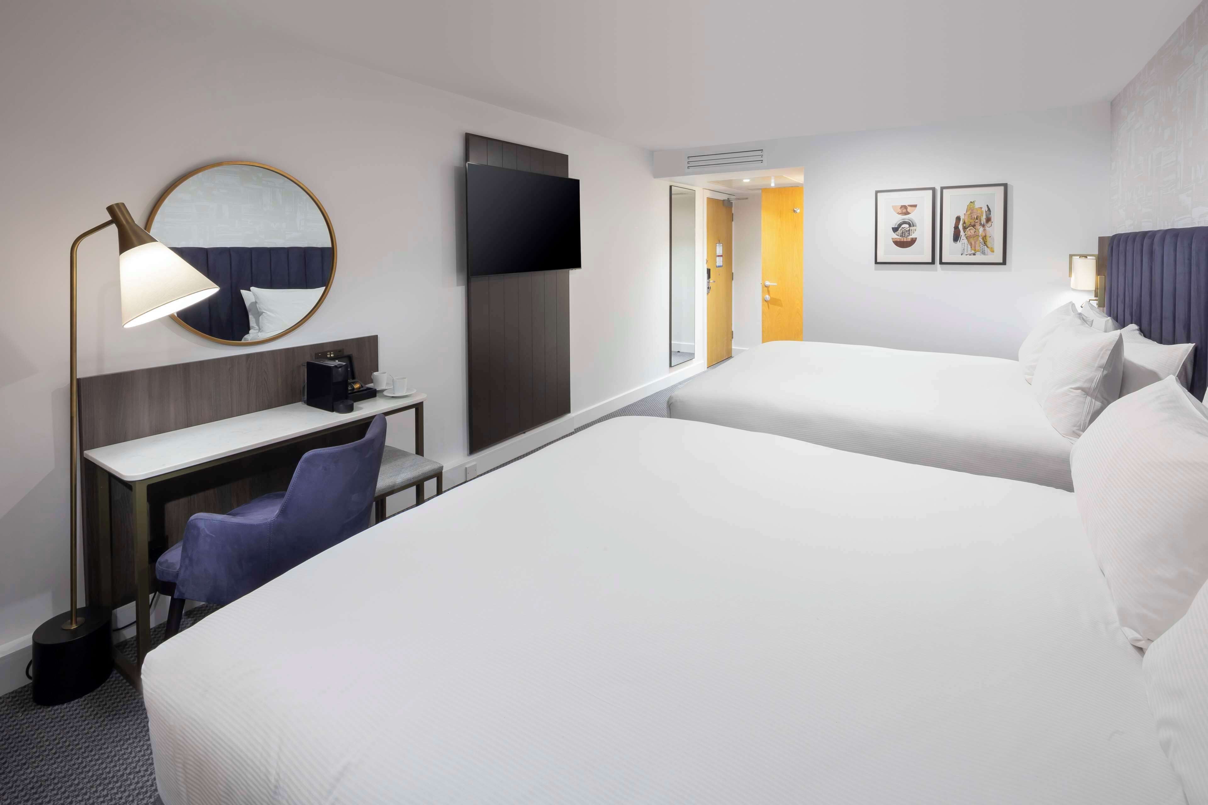 deluxe room, multiple beds | premium bedding, minibar, in-room safe, individually decorated