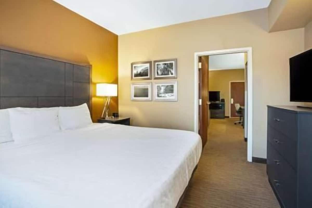 Premium bedding, desk, laptop workspace, iron/ironing board