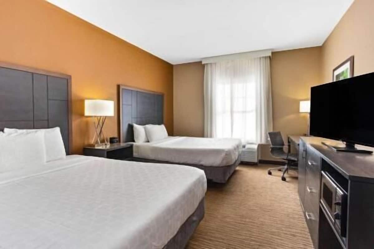 Premium bedding, desk, laptop workspace, iron/ironing board