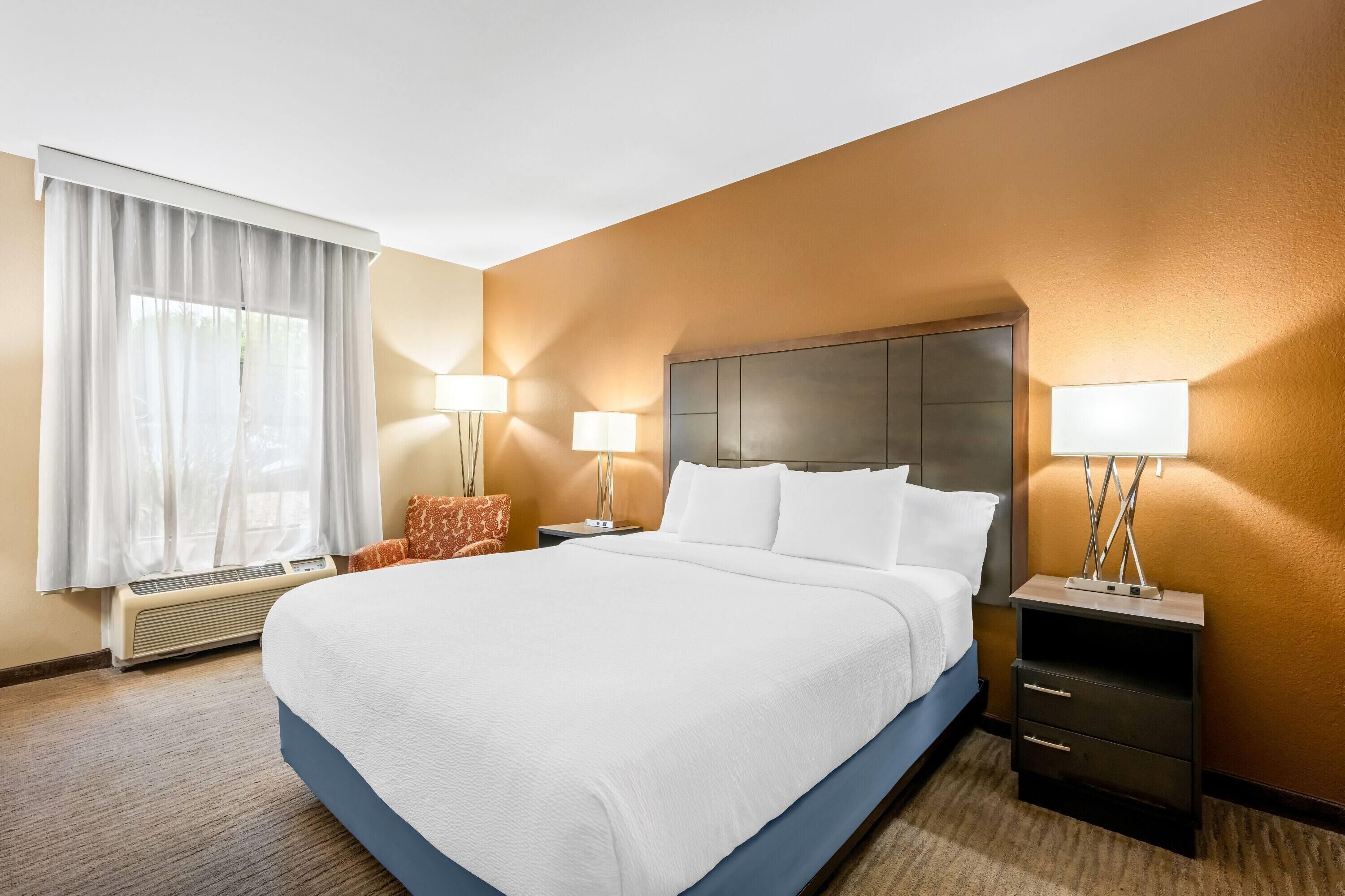 Premium bedding, desk, laptop workspace, iron/ironing board