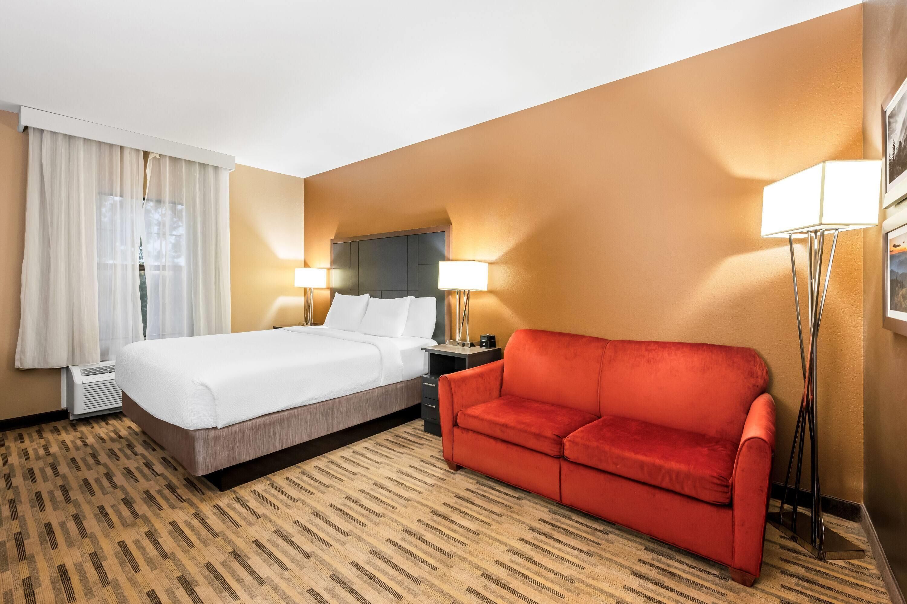 Premium bedding, desk, laptop workspace, iron/ironing board