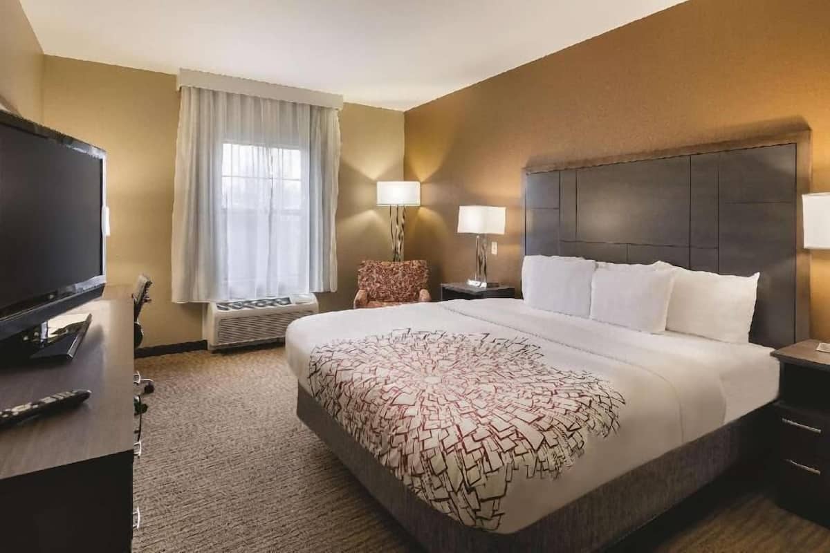 Premium bedding, desk, laptop workspace, iron/ironing board