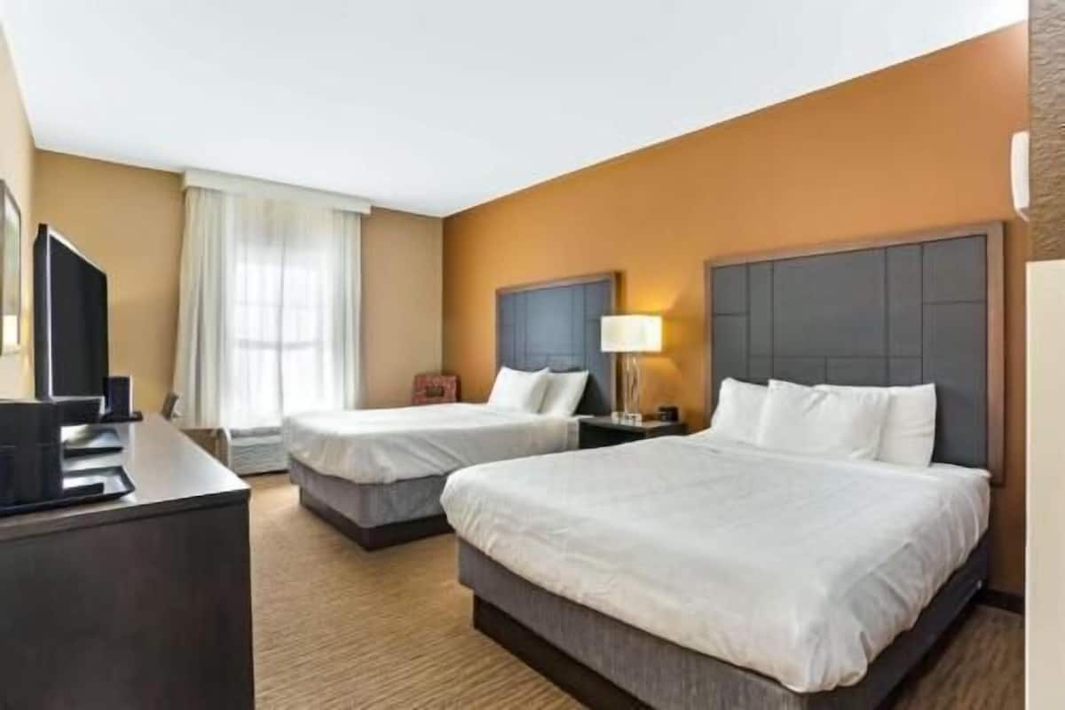 Premium bedding, desk, laptop workspace, iron/ironing board