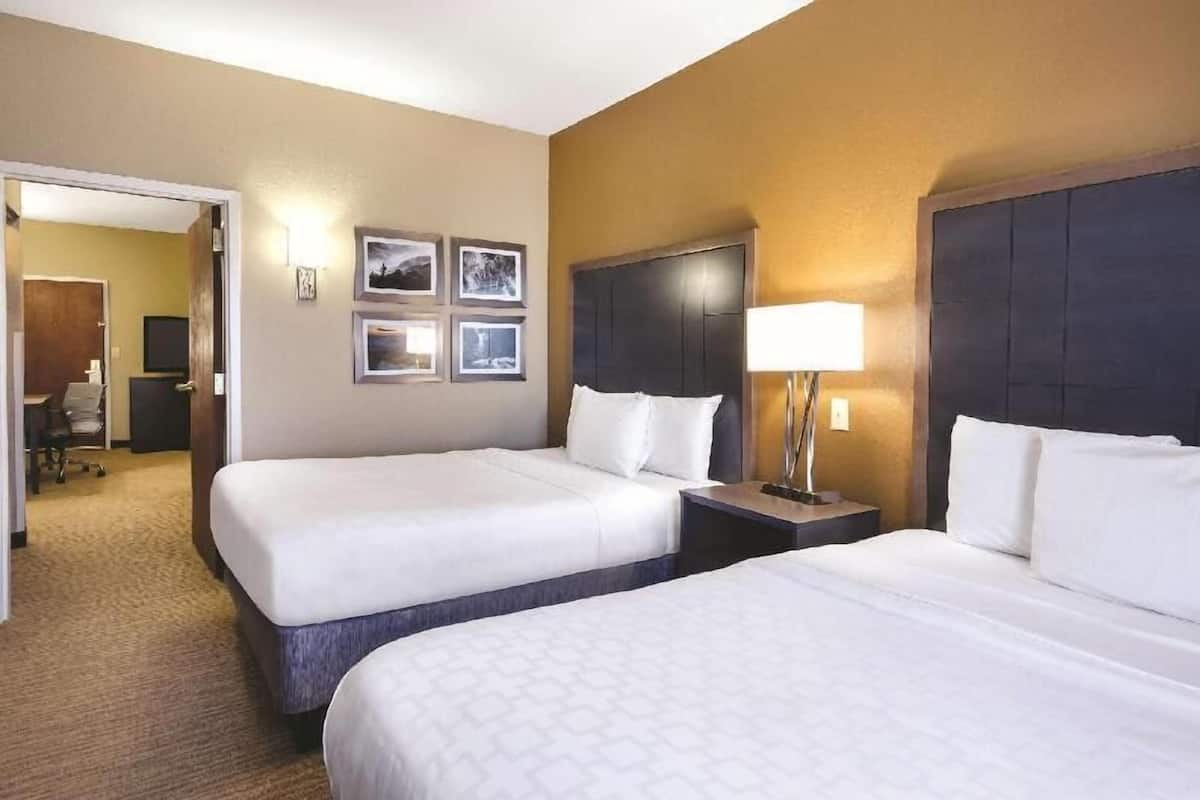 Premium bedding, desk, laptop workspace, iron/ironing board