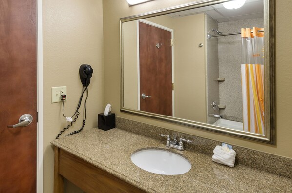 A bathroom with a sink, mirror, and towel rack. - La Quinta Inn & Suites by Wyndham Boone University (Boone)