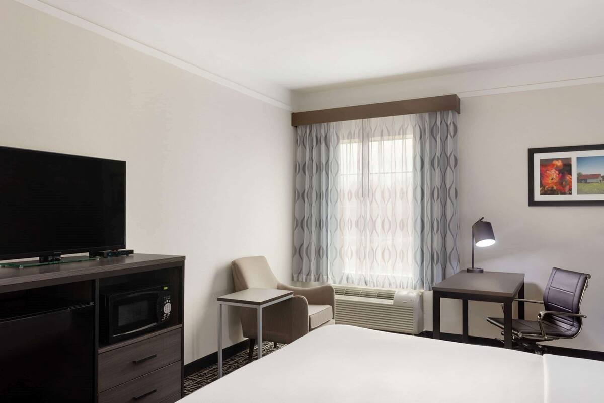 Premium bedding, desk, blackout drapes, iron/ironing board