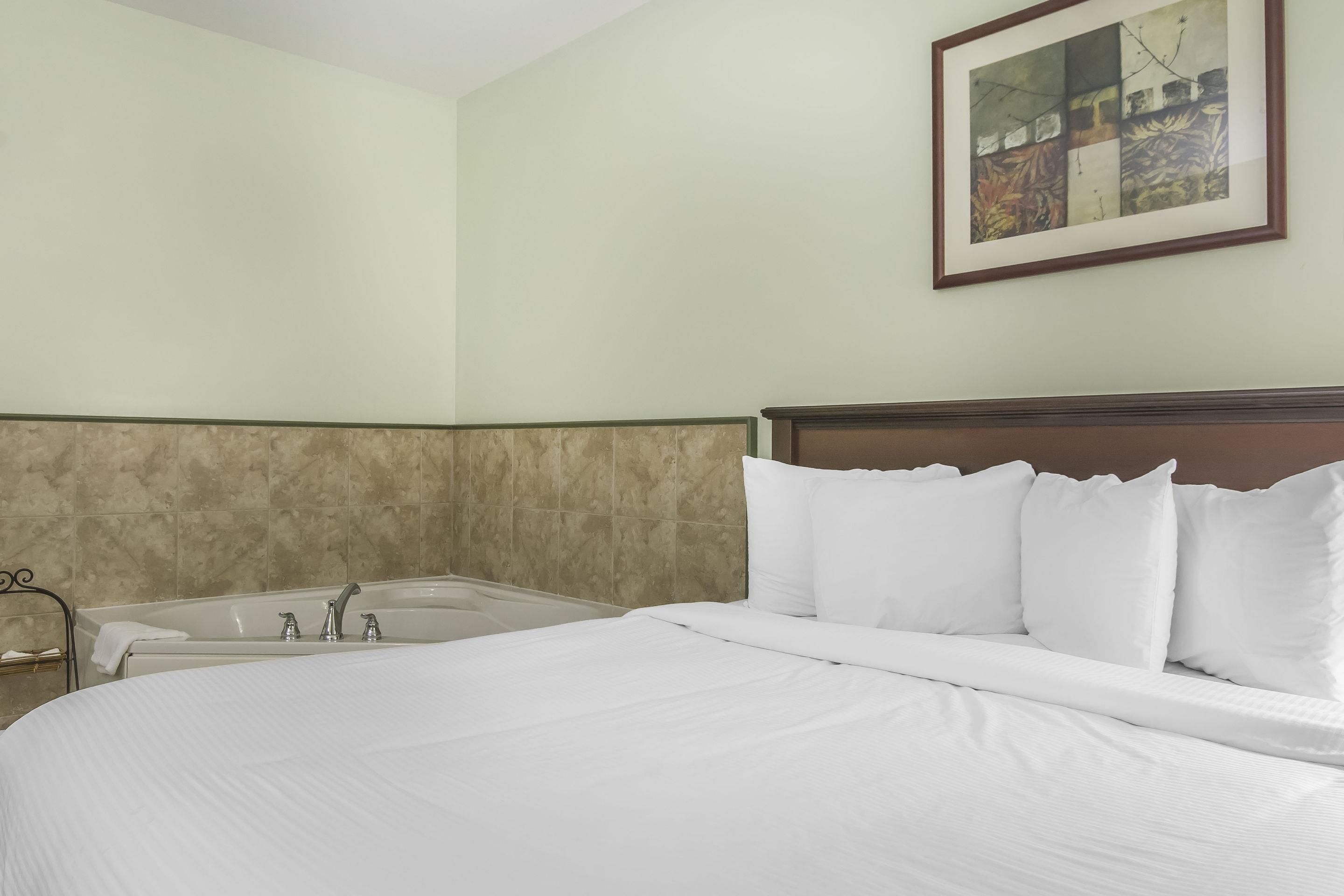 Select Comfort beds, desk, blackout drapes, iron/ironing board