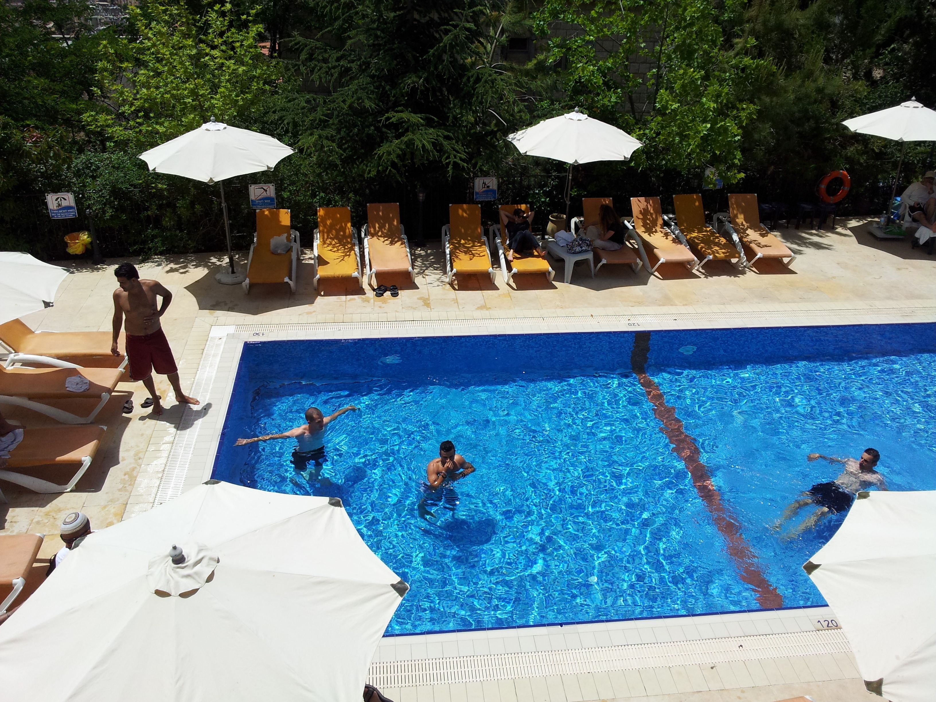 seasonal outdoor pool, pool umbrellas, pool loungers