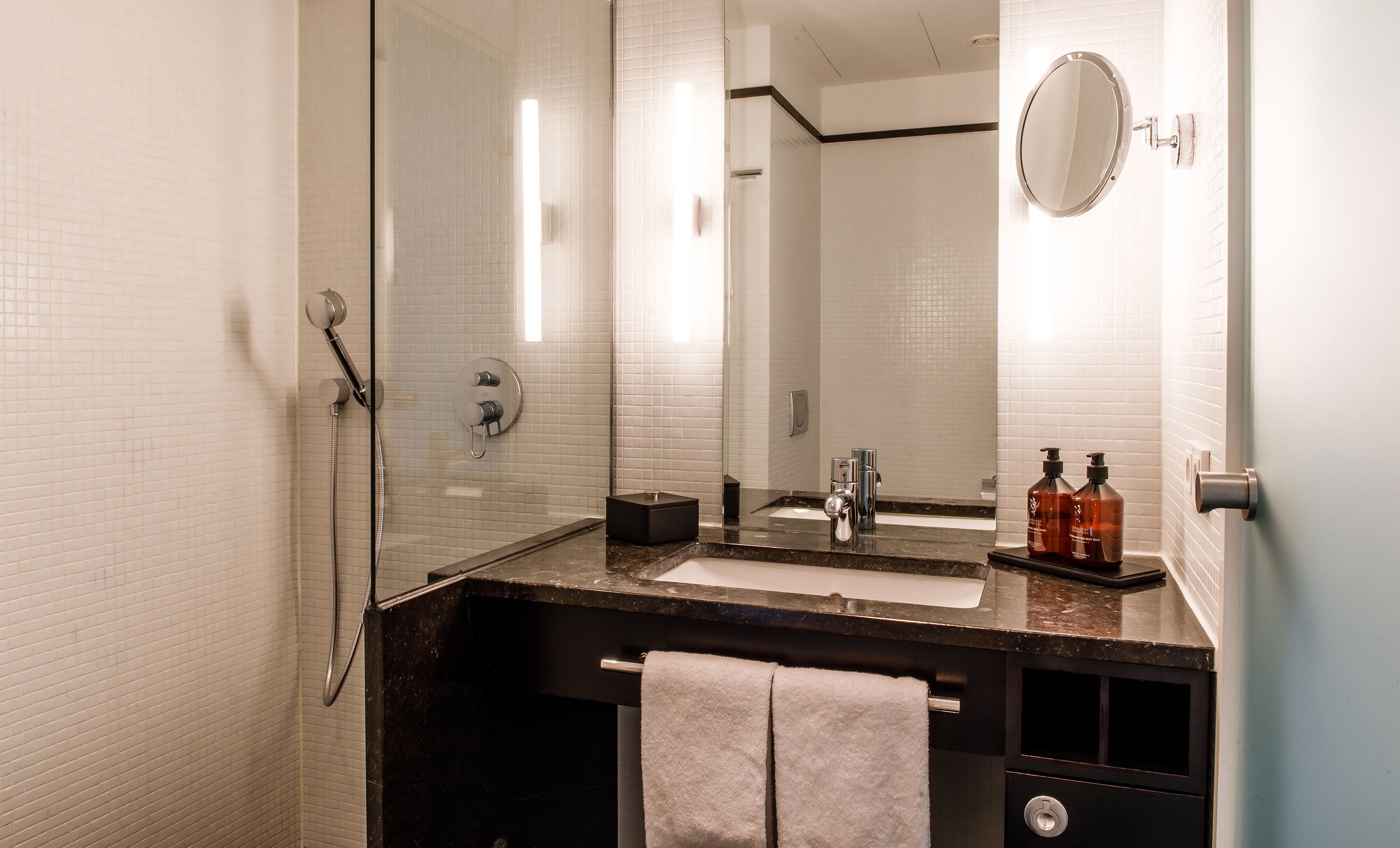 combined shower/bathtub, designer toiletries, bathrobes, slippers