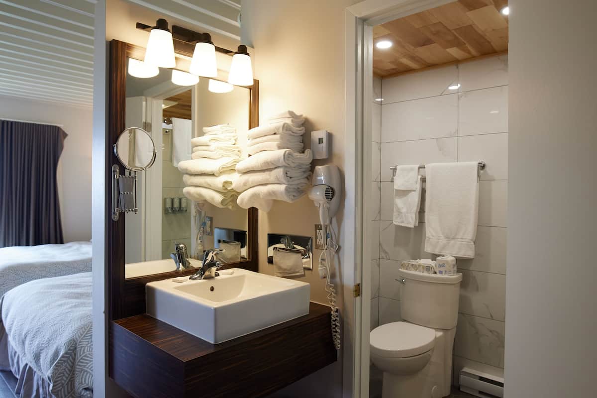 panoramic room, 2 queen beds, balcony | bathroom | free toiletries, hair dryer, towels