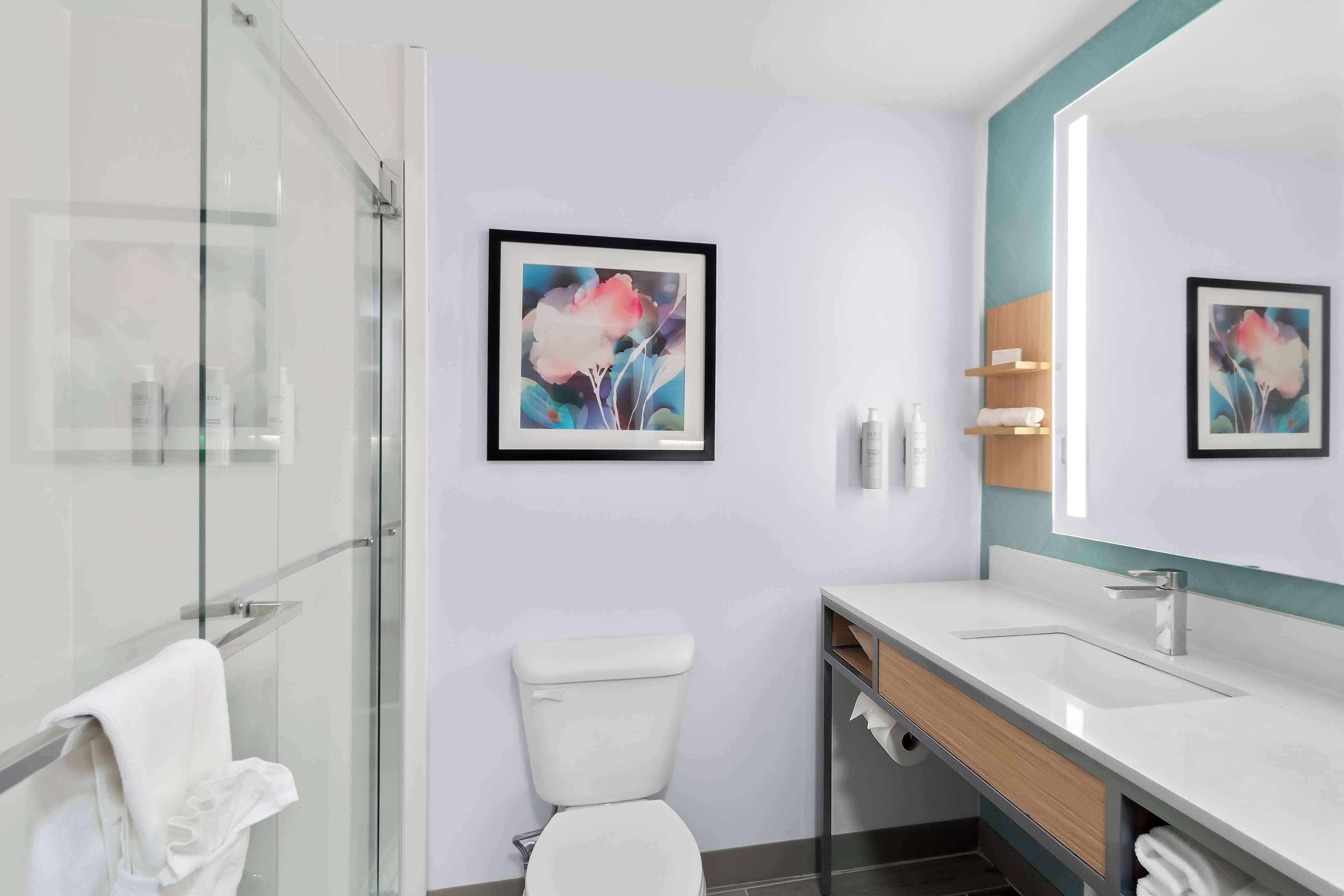 designer toiletries, hair dryer, towels, soap