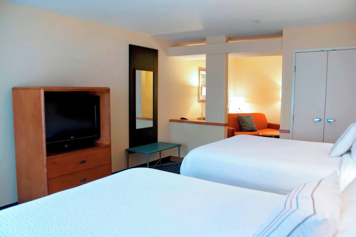 Suite, Multiple Beds | Premium bedding, desk, laptop workspace, iron/ironing board