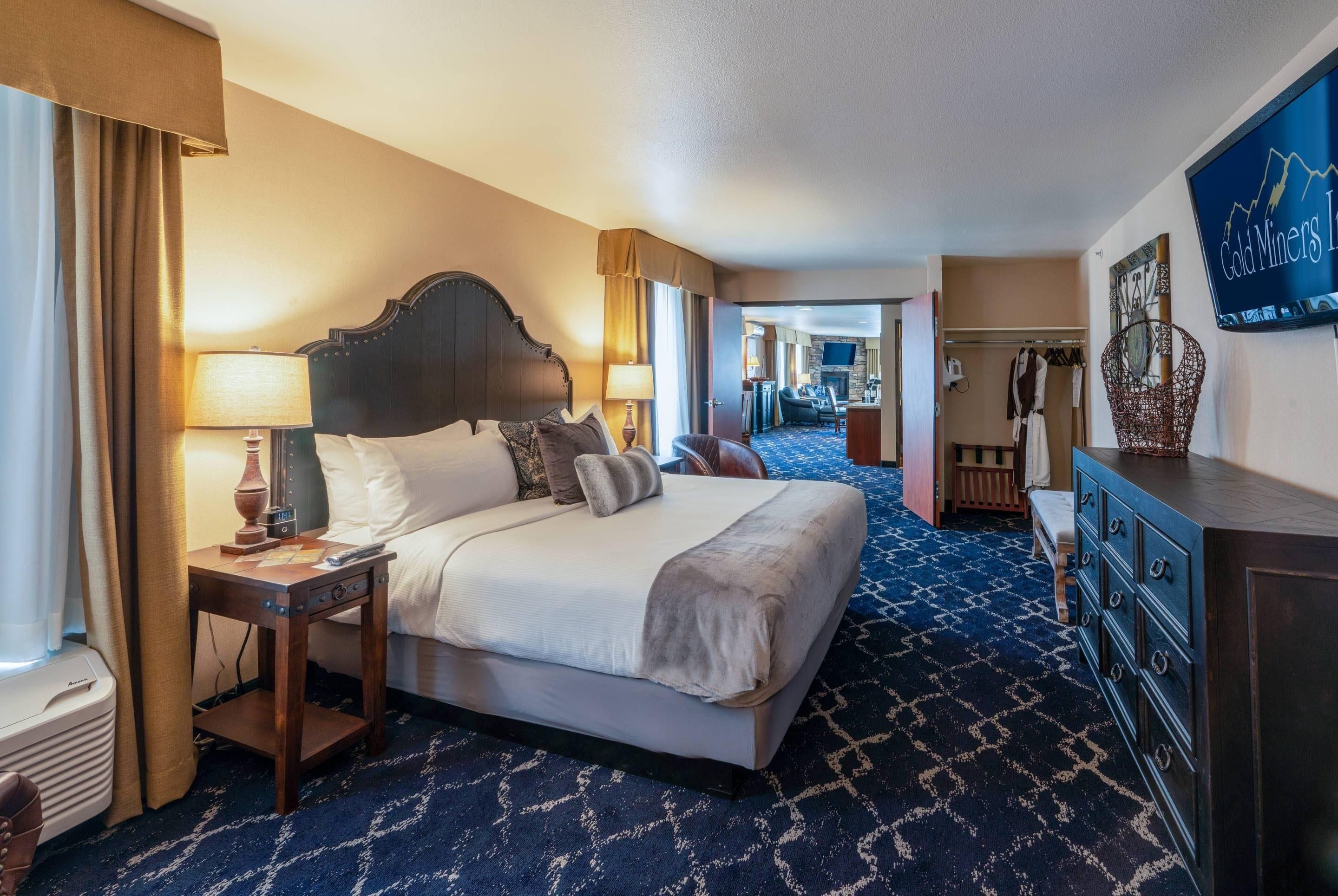 Desk, laptop workspace, blackout drapes, iron/ironing board