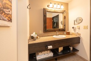 Designer toiletries, hair dryer, towels, soap
