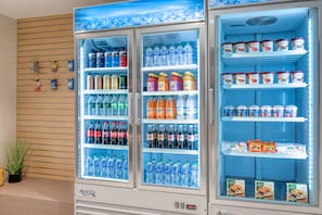A vending machine stocked with various beverages and snacks.