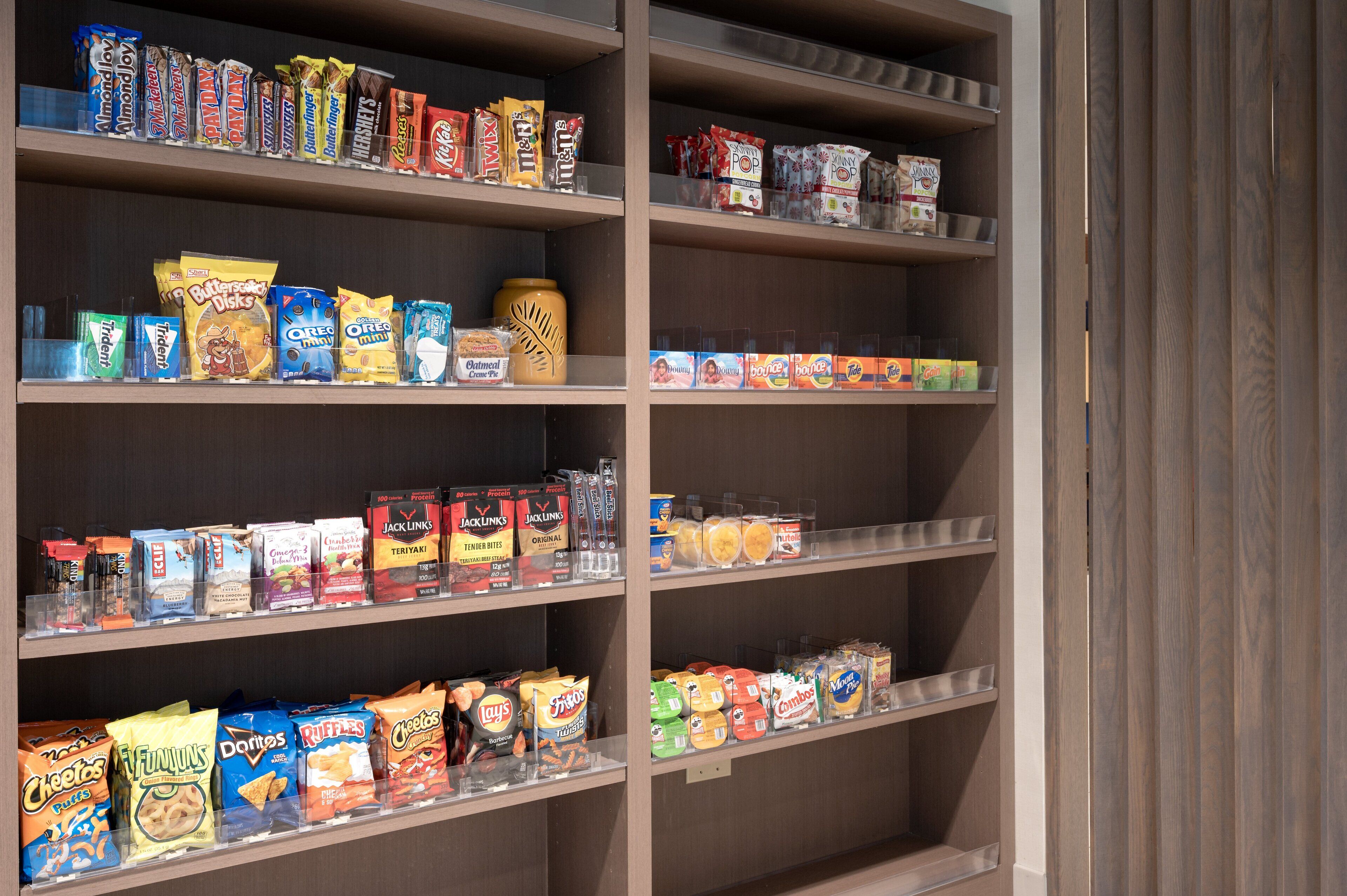 A snack display with various brands and types of snacks.