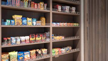 A snack display with various brands and types of snacks.