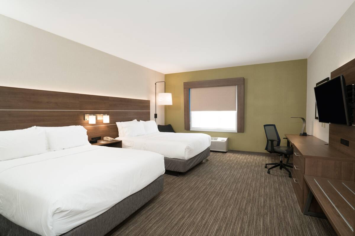 Premium bedding, desk, laptop workspace, blackout drapes
