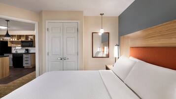 Premium bedding, desk, laptop workspace, blackout curtains