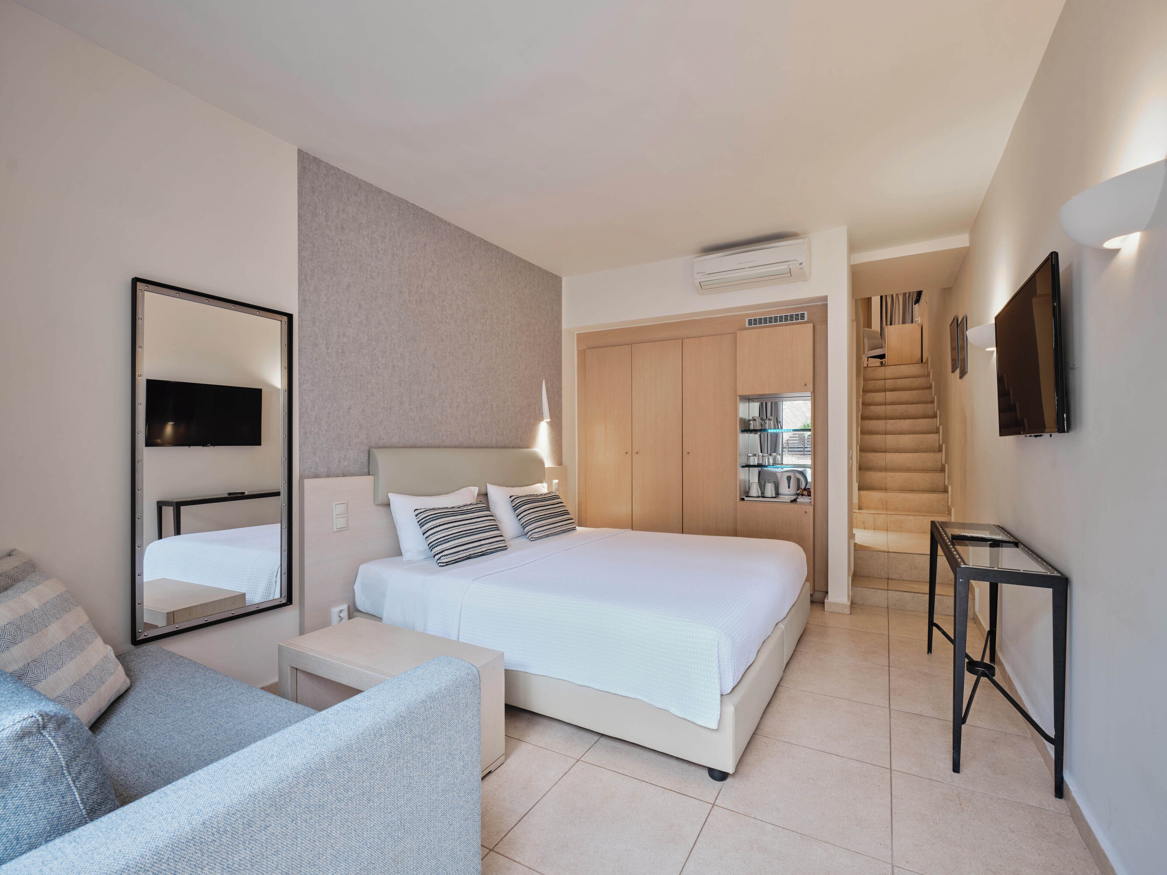 Maisonette Two-Bedroom with Pool View | Minibar, in-room safe, desk, blackout drapes