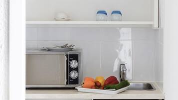 Apartamento standard, 1 quarto | Escrivaninha, roupa de cama, despertadores