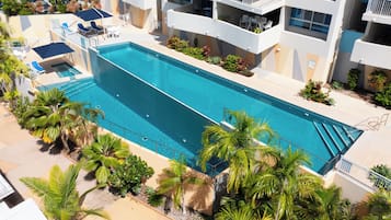 2 outdoor pools, open 7:30 AM to 7:30 PM, pool umbrellas, pool loungers