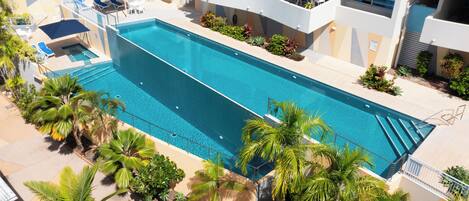 2 outdoor pools, open 7:30 AM to 7:30 PM, pool umbrellas, pool loungers