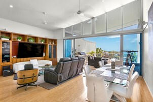 55-inch TV with satellite channels, DVD player, books