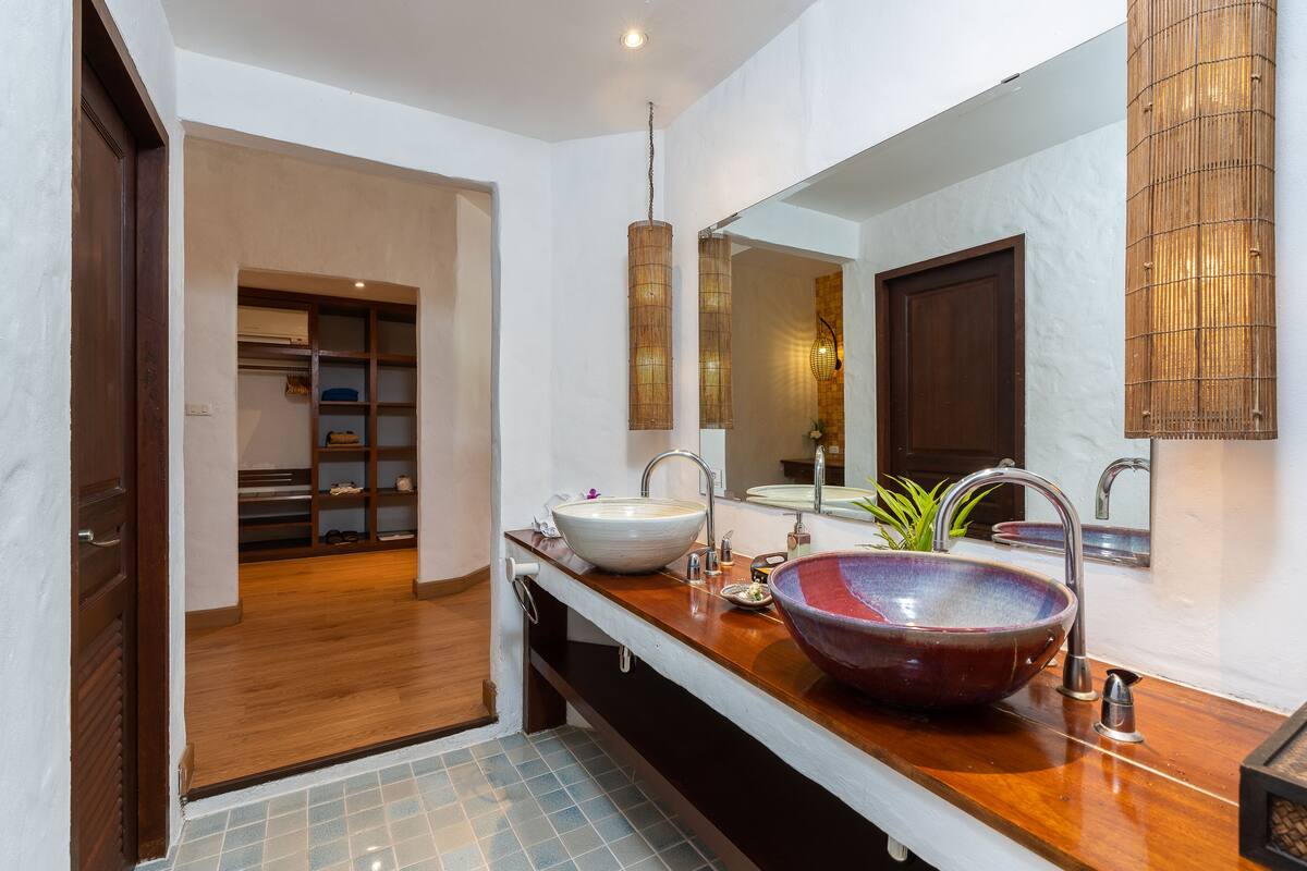 one-bedroom pool villa | bathroom | eco-friendly toiletries, hair dryer, bathrobes, slippers