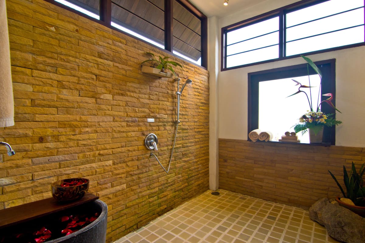 superior studio | bathroom | eco-friendly toiletries, hair dryer, bathrobes, slippers