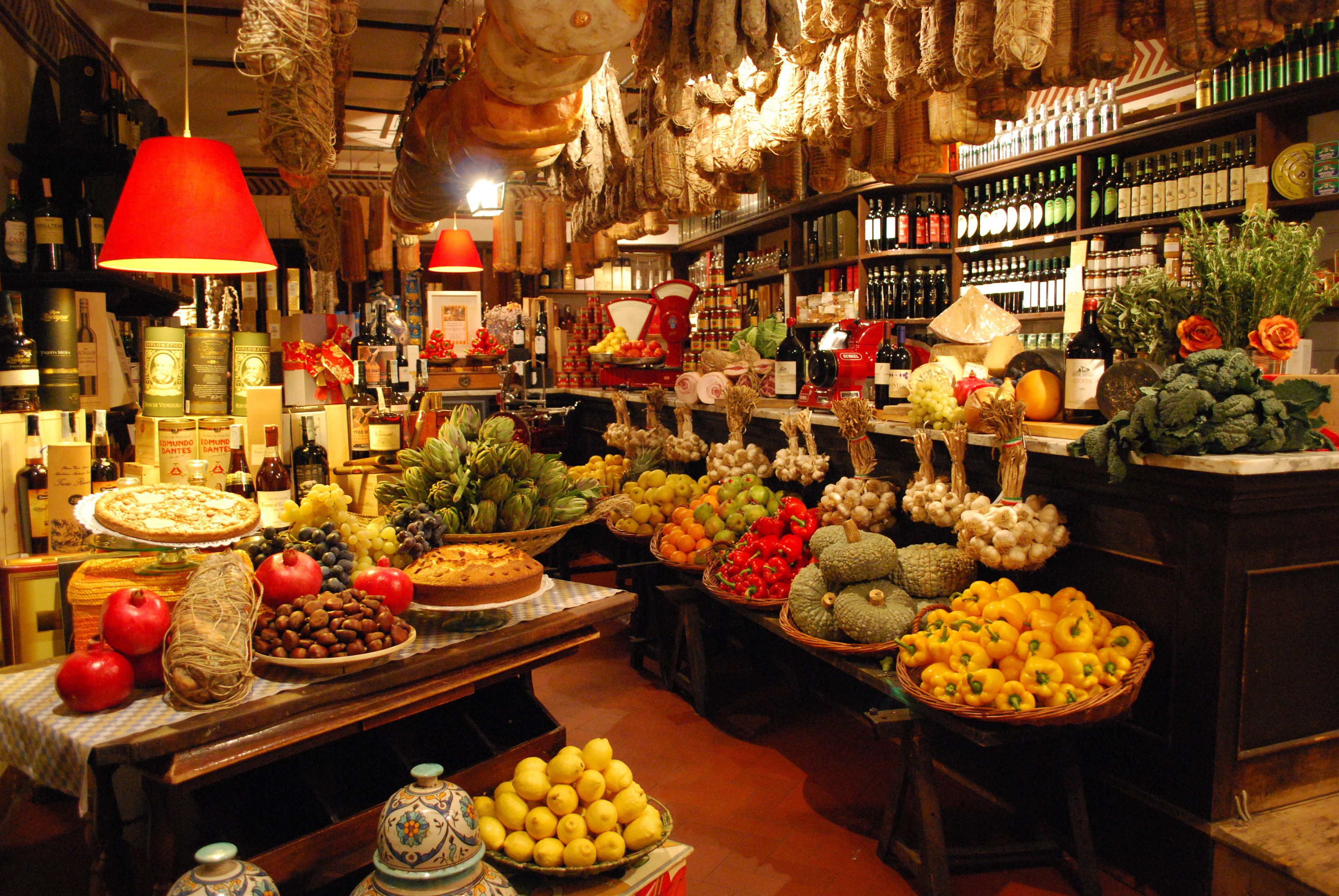 A market with various food items and wine bottles.
