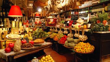 A market with various food items and wine bottles.