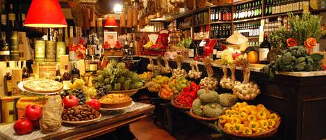 A market with various food items and wine bottles.
