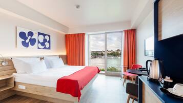 Room, River View | Minibar, in-room safe, blackout drapes, free cribs/infant beds