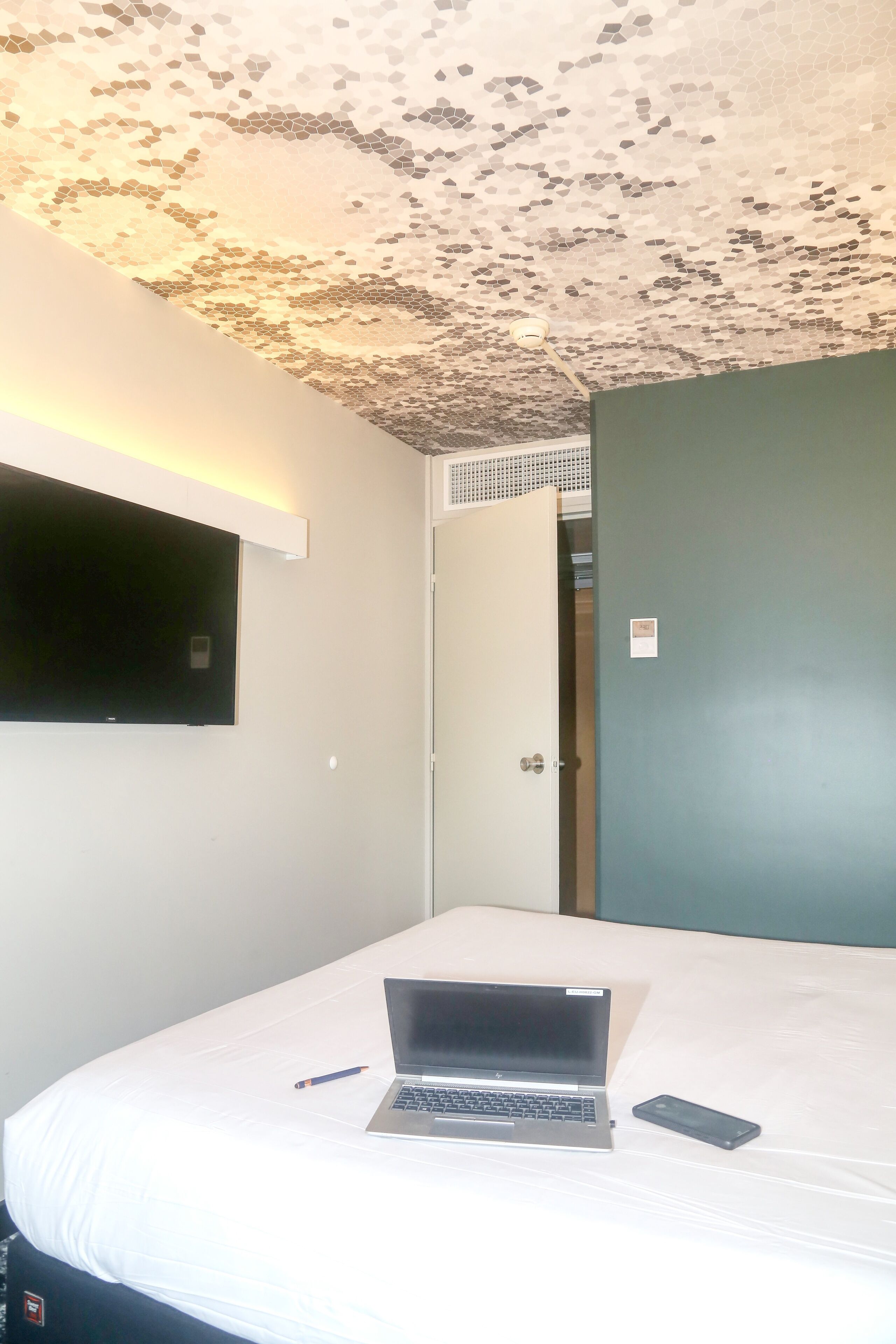 premium bedding, desk, blackout curtains, soundproofing