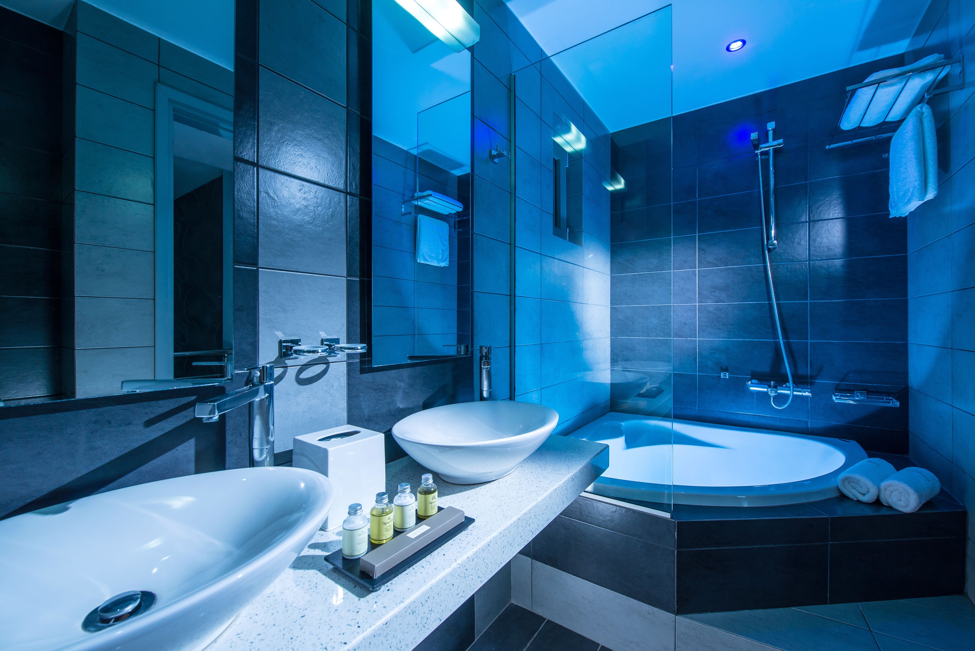 superior suite, sea view | bathroom | rainfall showerhead, designer toiletries, hair dryer, bathrobes