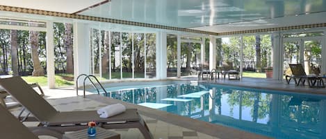 Indoor pool, open 8:00 AM to 8:00 PM, pool loungers
