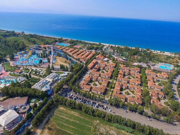 An aerial view of a coastal resort with a large swimming pool, a water park, and a beach. - Futura Club Itaca Nausicaa (Corigliano-Rossano)