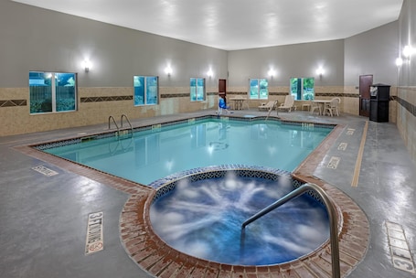 Indoor pool, open 7:00 AM to 10:00 PM, pool loungers. Best Western South Plains Inn & Suites