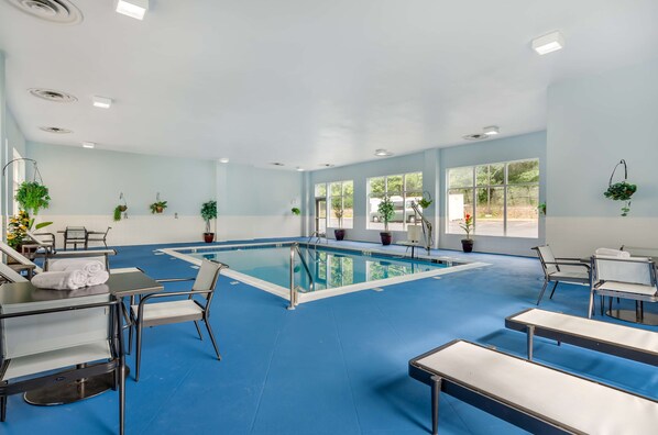 Indoor pool, open 8:00 AM to 10:00 PM, pool loungers