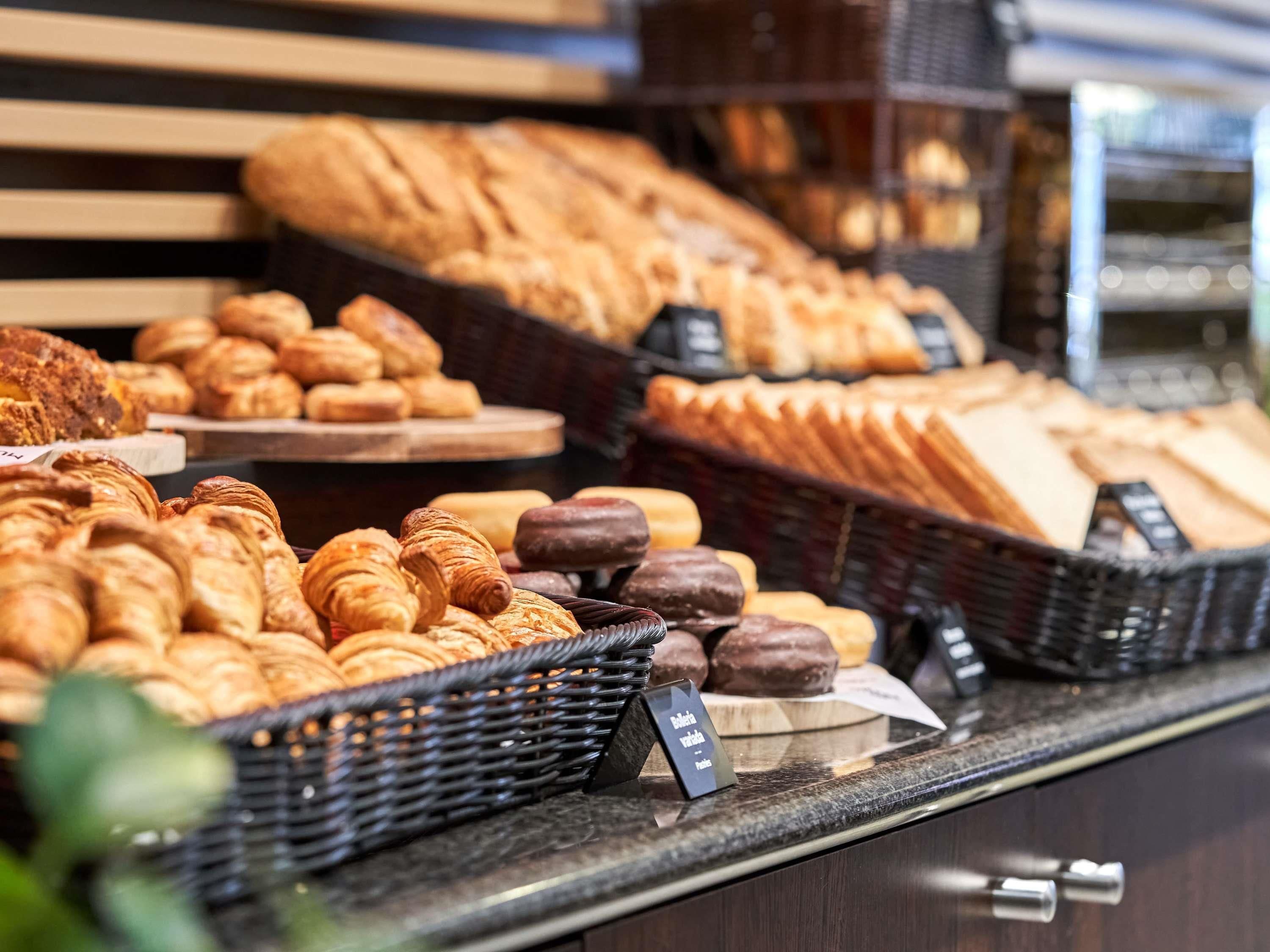 A bakery display with various baked goods.