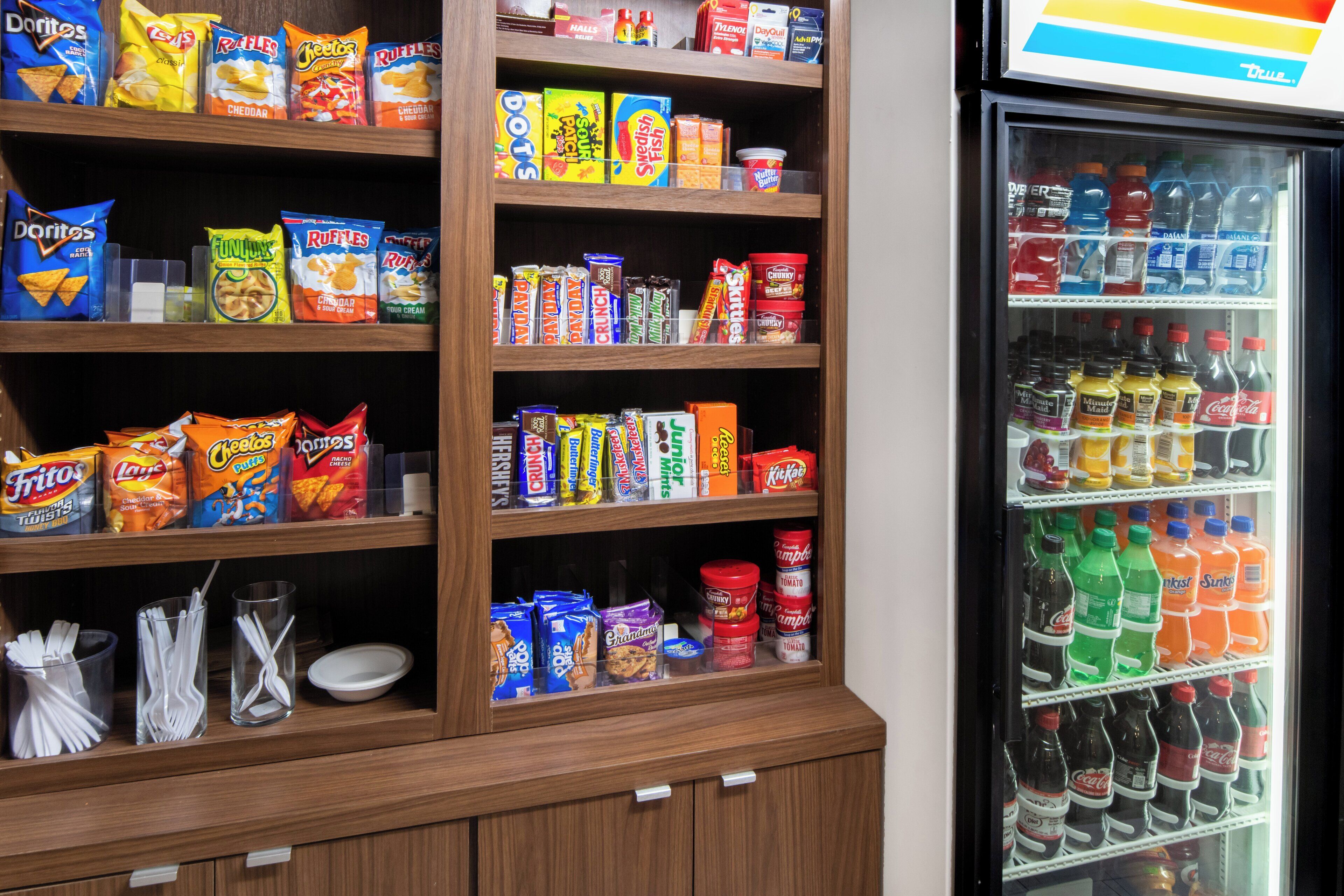 A snack and drink vending machine with various snacks and beverages.