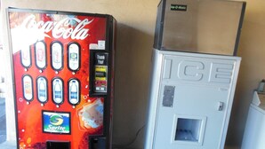 A Coca-Cola vending machine and an ice dispenser. - Sealamp Inn (Seaside)