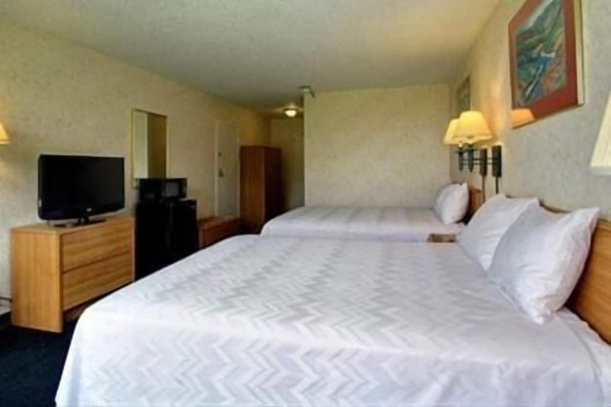 Chambre Standard, 1 grand lit | Bureau, accÚs au Wi-Fi (inclus), literie fournie, réveille-matin