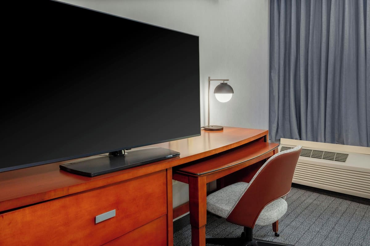 Pillowtop beds, desk, blackout drapes, iron/ironing board