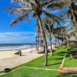 On the beach, white sand, sun-loungers, beach umbrellas