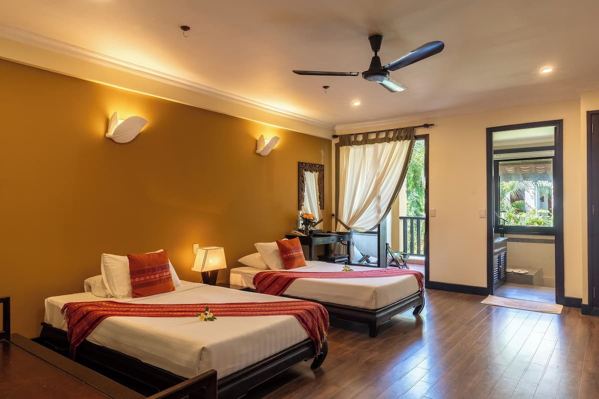 Deluxe Room, 1 Double or 2 Single Beds | 1 bedroom, down duvets, minibar, in-room safe