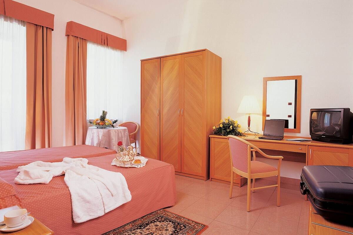 Standard Triple Room | Minibar, in-room safe, desk, soundproofing